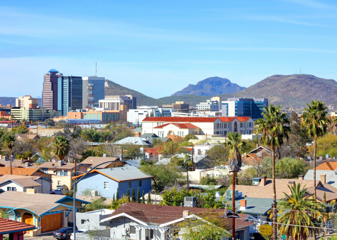 Homes and downtown Tucson in a mountainous landscape.