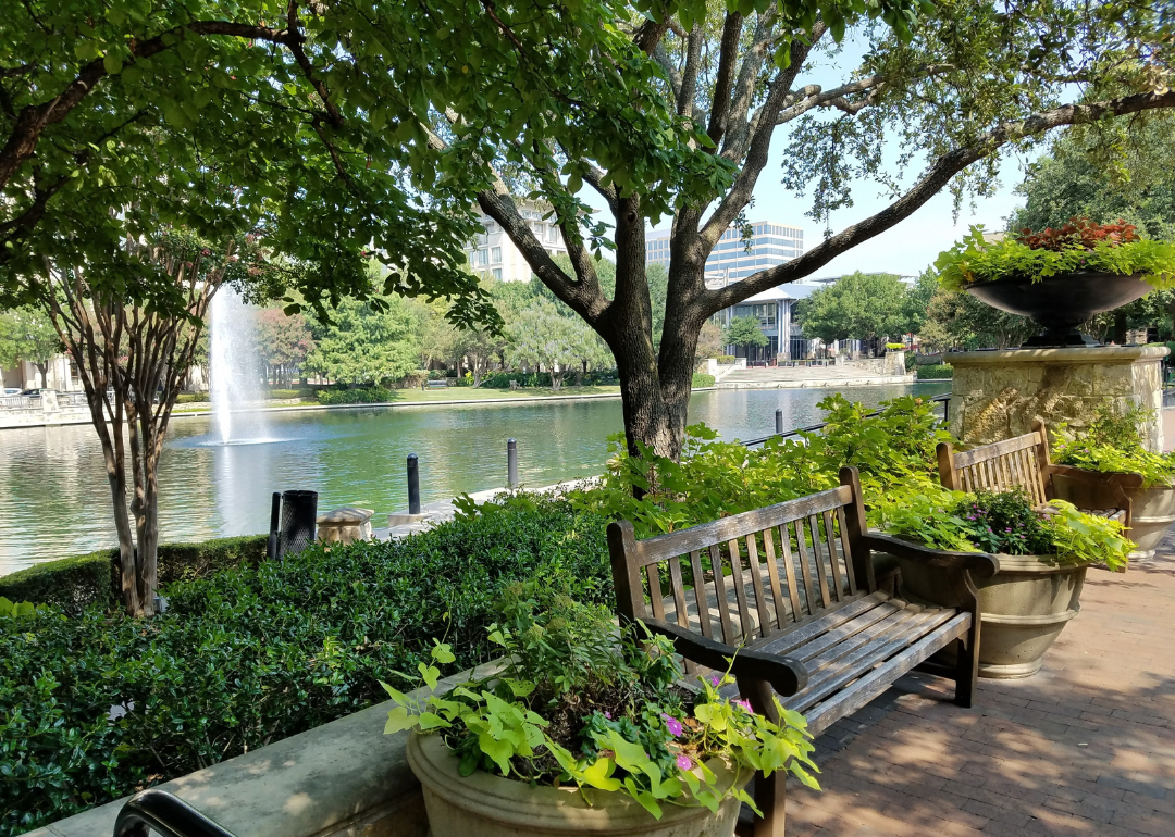 Park benches and a water feature at a shopping center.