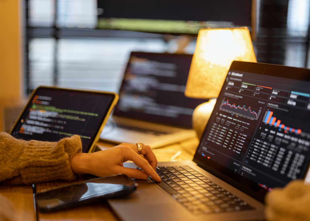 A woman running statistical software on a laptop.