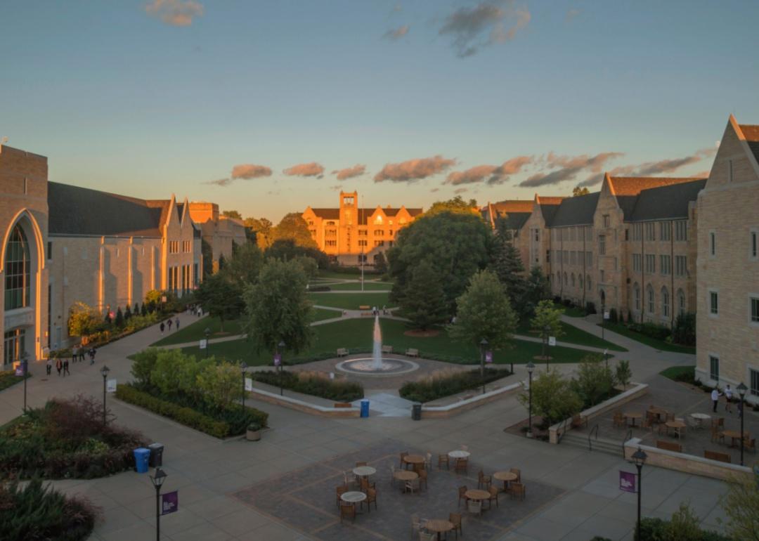 A large courtyard with university buildings lining the sides.