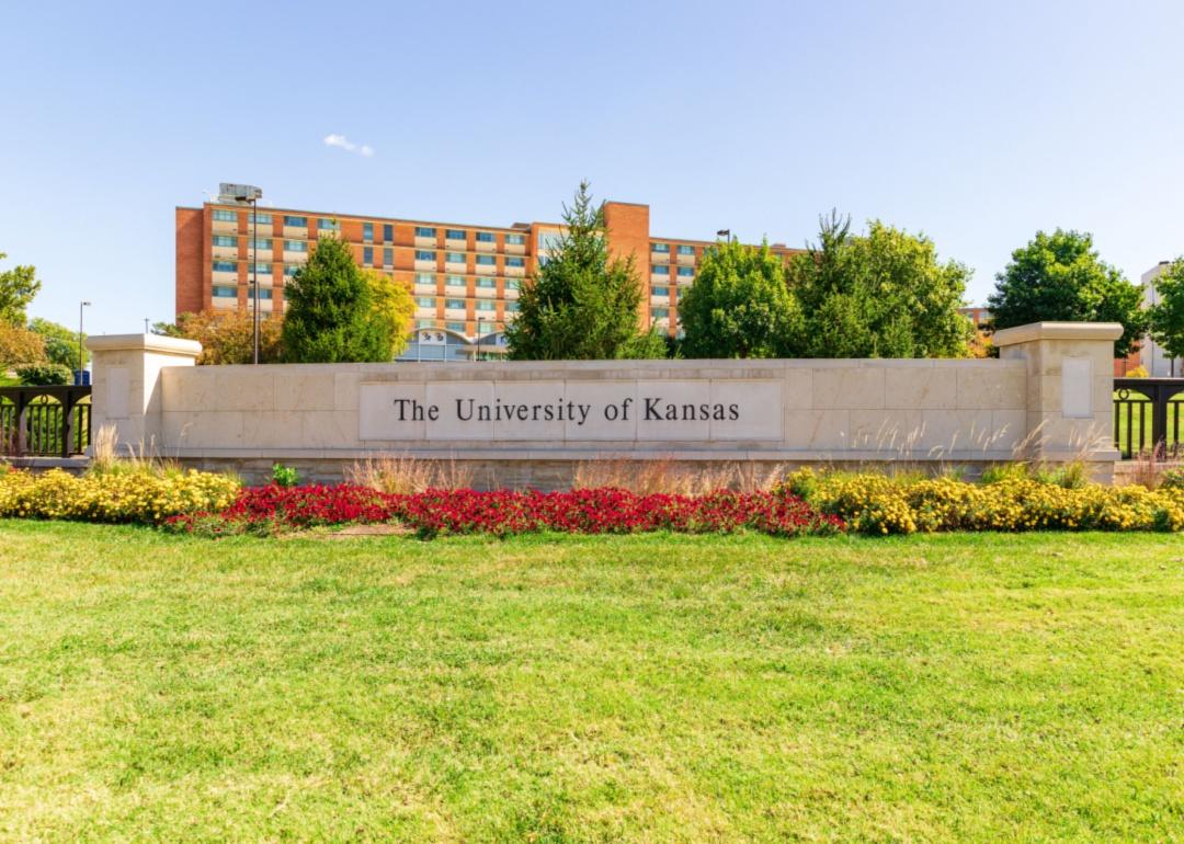 A rectangular stone sign for University of Kansas.