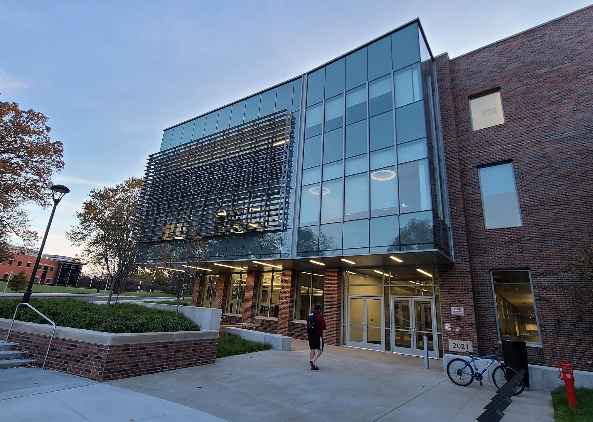 A brick building with a modern glass front.