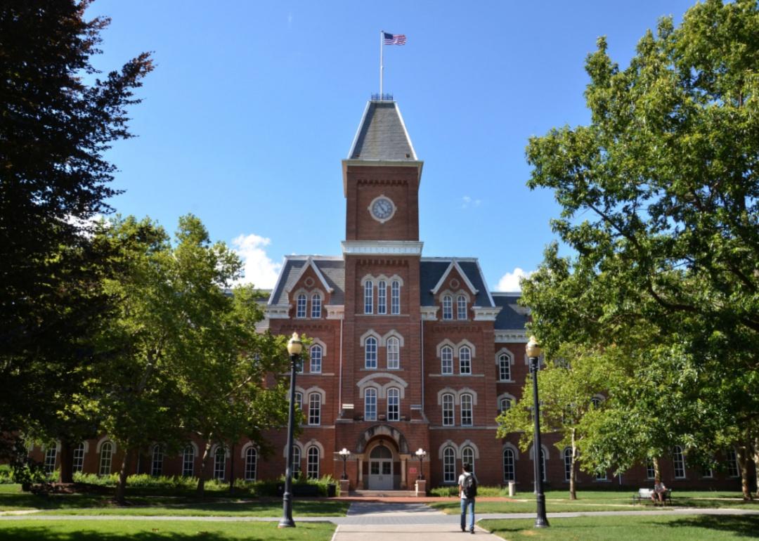 A brick building with a clocktower on top.