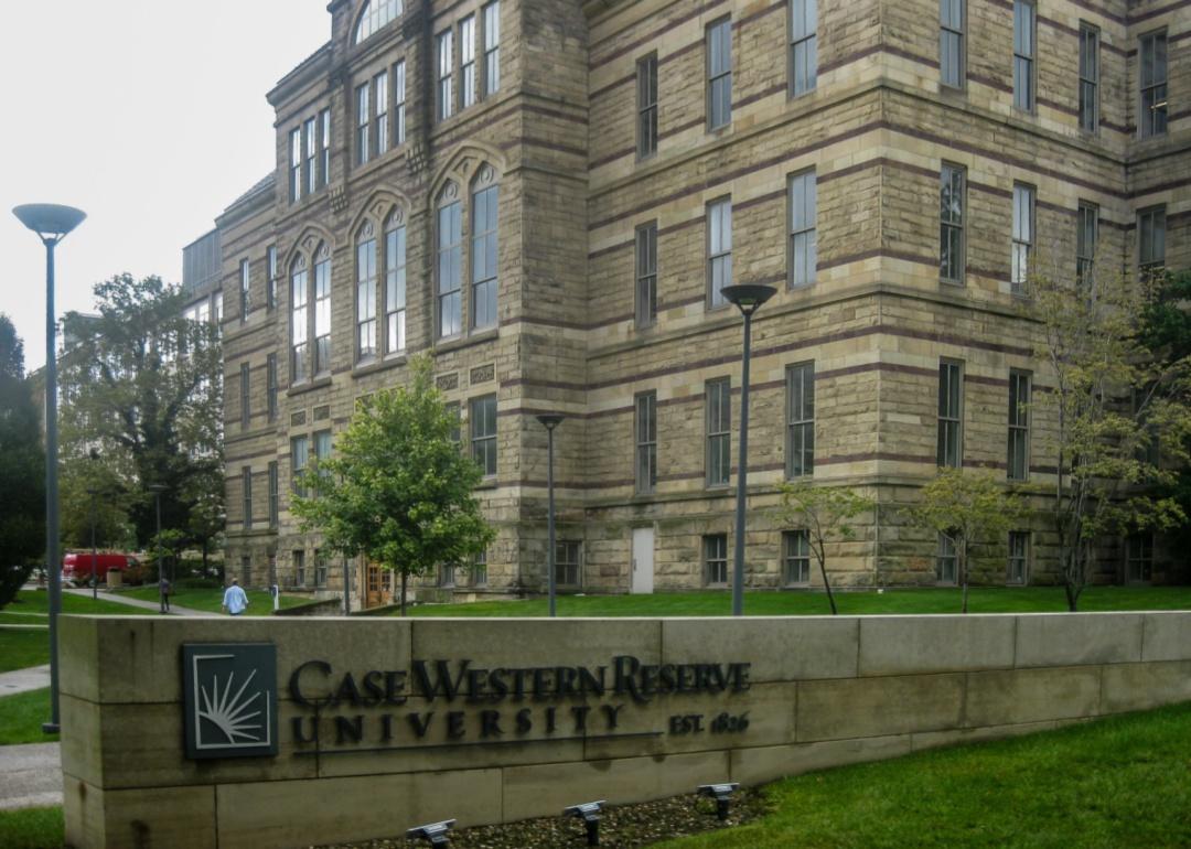 A large stone building with a Case Western Reserve University sign in front.