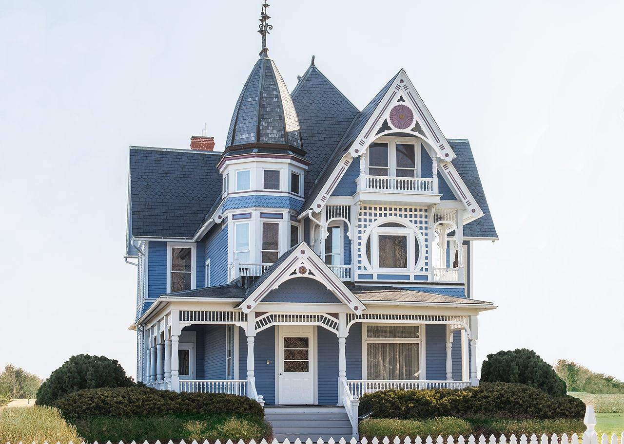 A blue Victorian style home.
