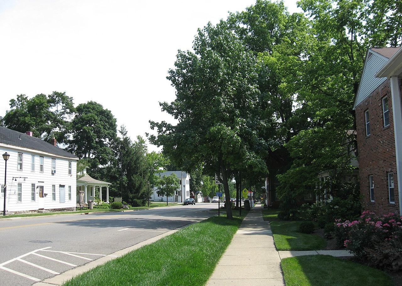 A main street lined with historic homes.