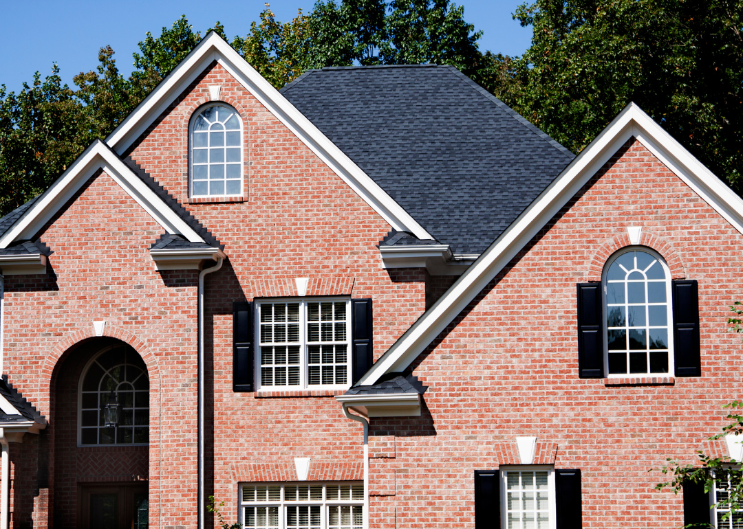 A large red brick home.