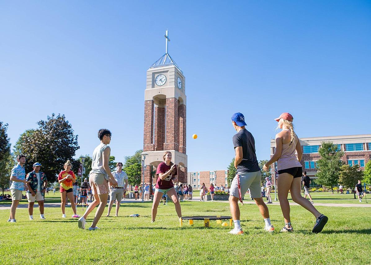Students playing lawn games on campus at Evangel University.