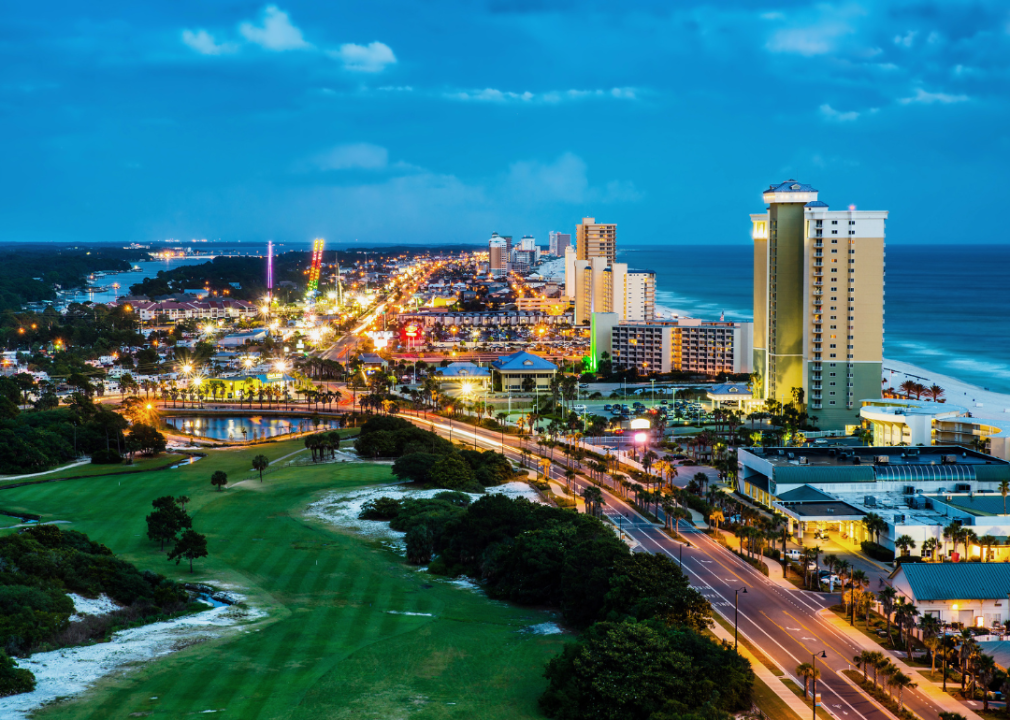 Roads and buildings lit up in Panama City Beach, Florida.