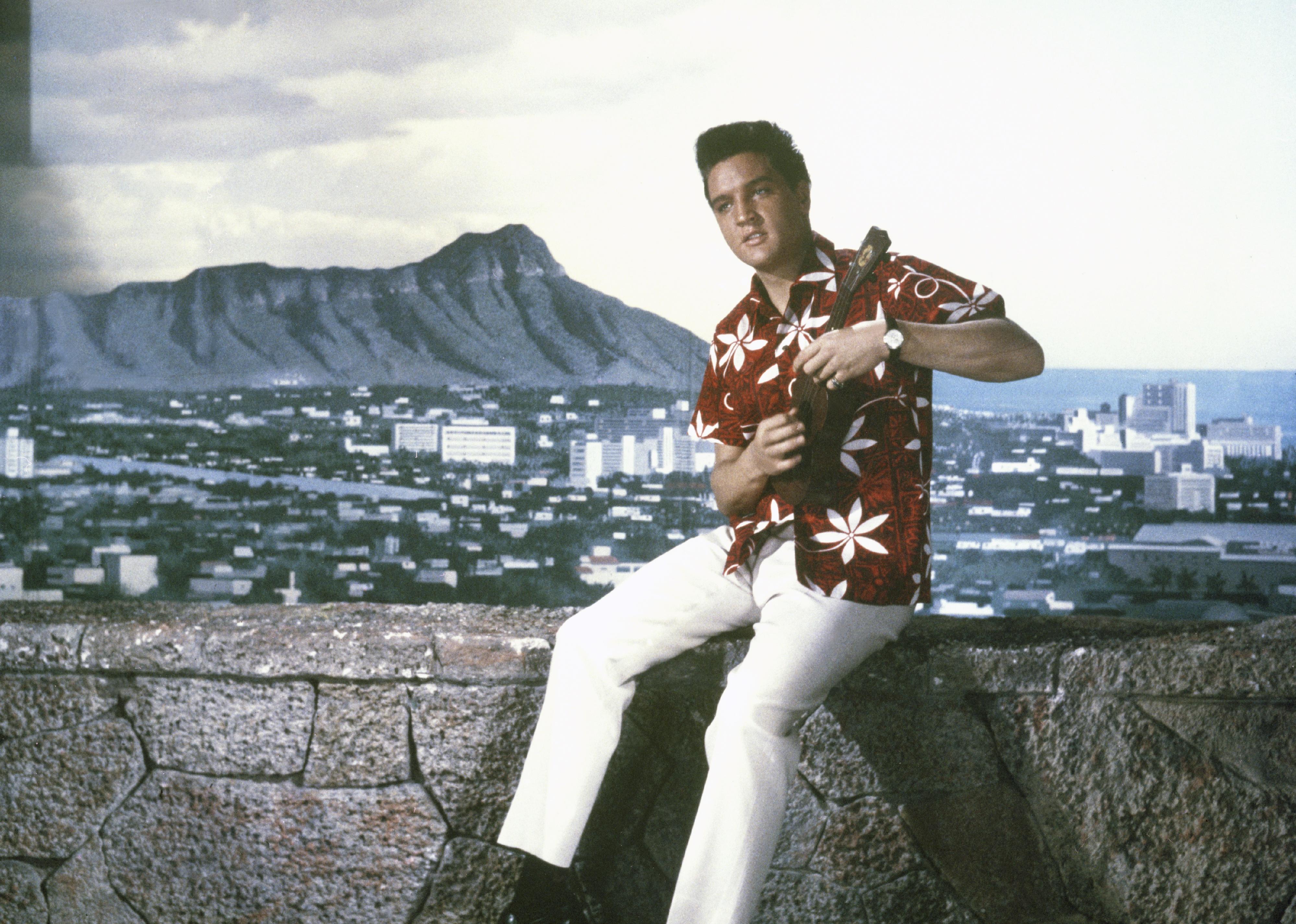 Elvis in a Hawaiian shirt on the set of Blue Hawaii.