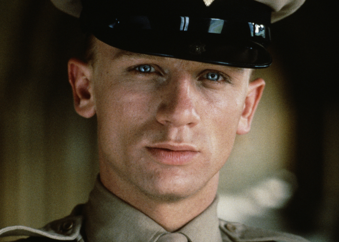 Daniel Craig in a brown military uniform.