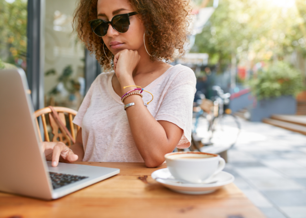 Woman at cafe checking email.