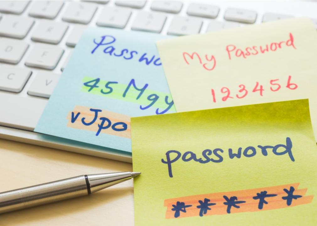 Post-it notes with passwords laying on a keyboard.