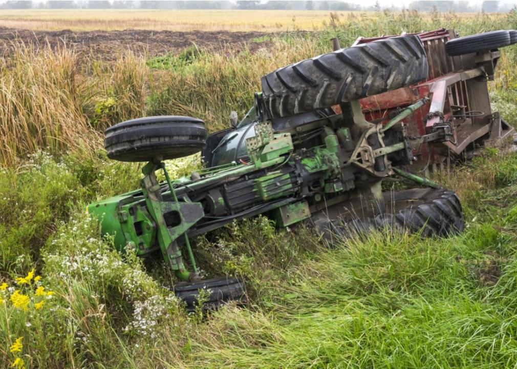 Tractor rolled over on its side