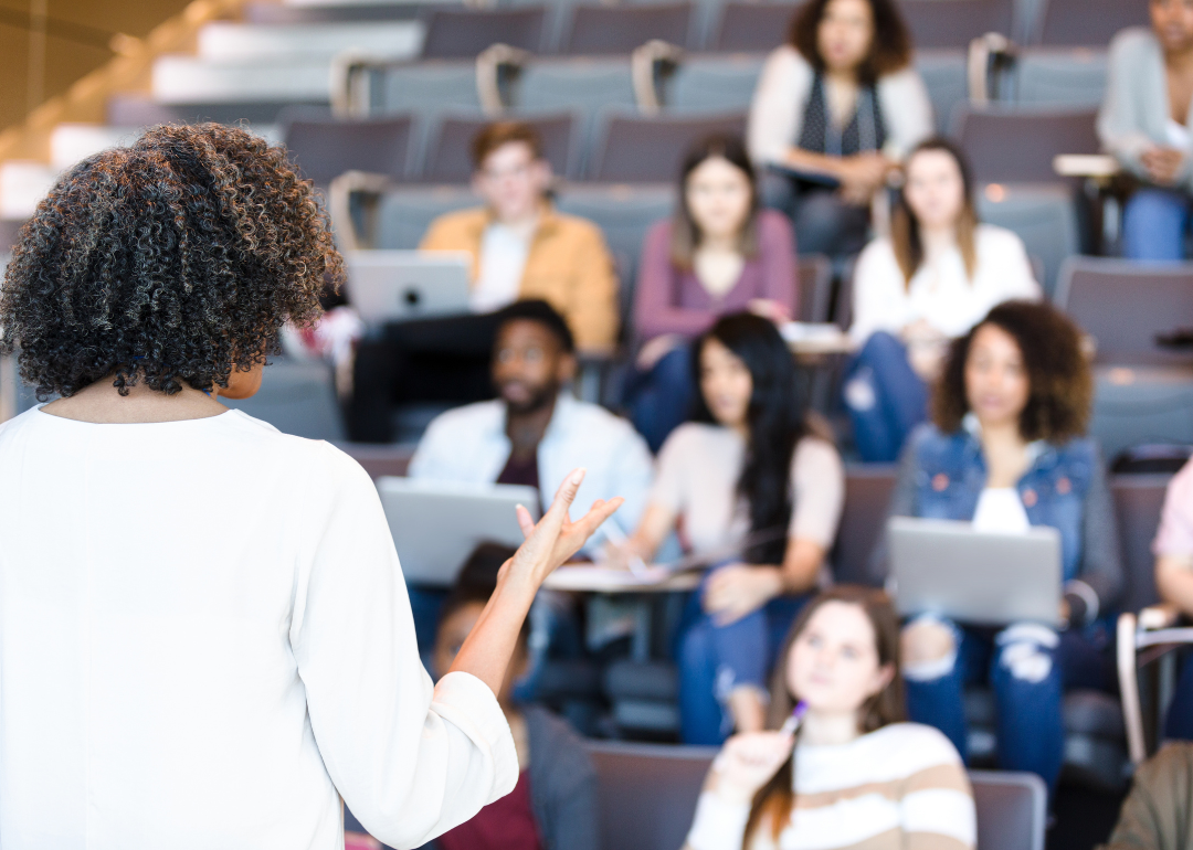 A college professor teaching a small group of students.