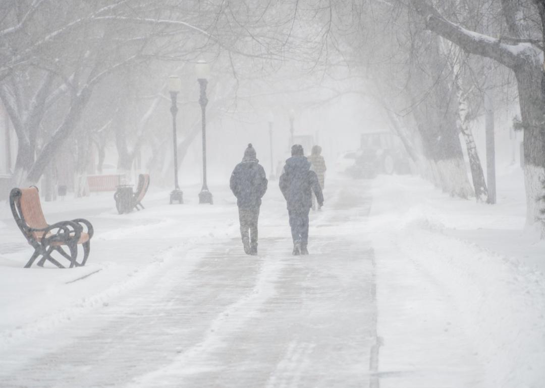 People walking through a blizzard.