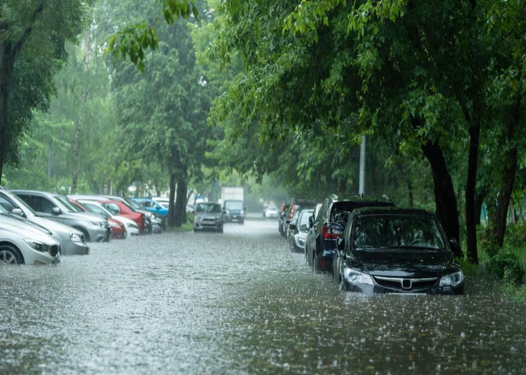 A flooded street of cars.