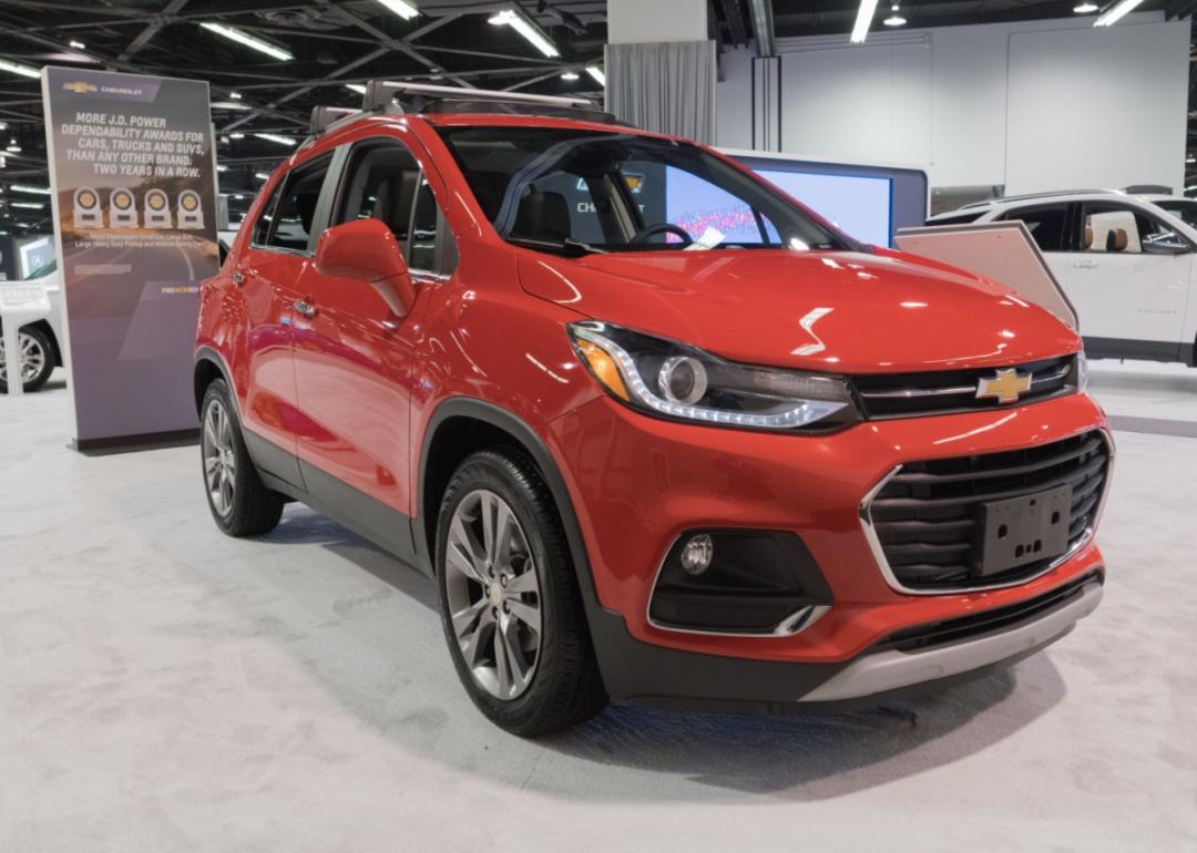 A red Chevrolet Trax in a showroom.