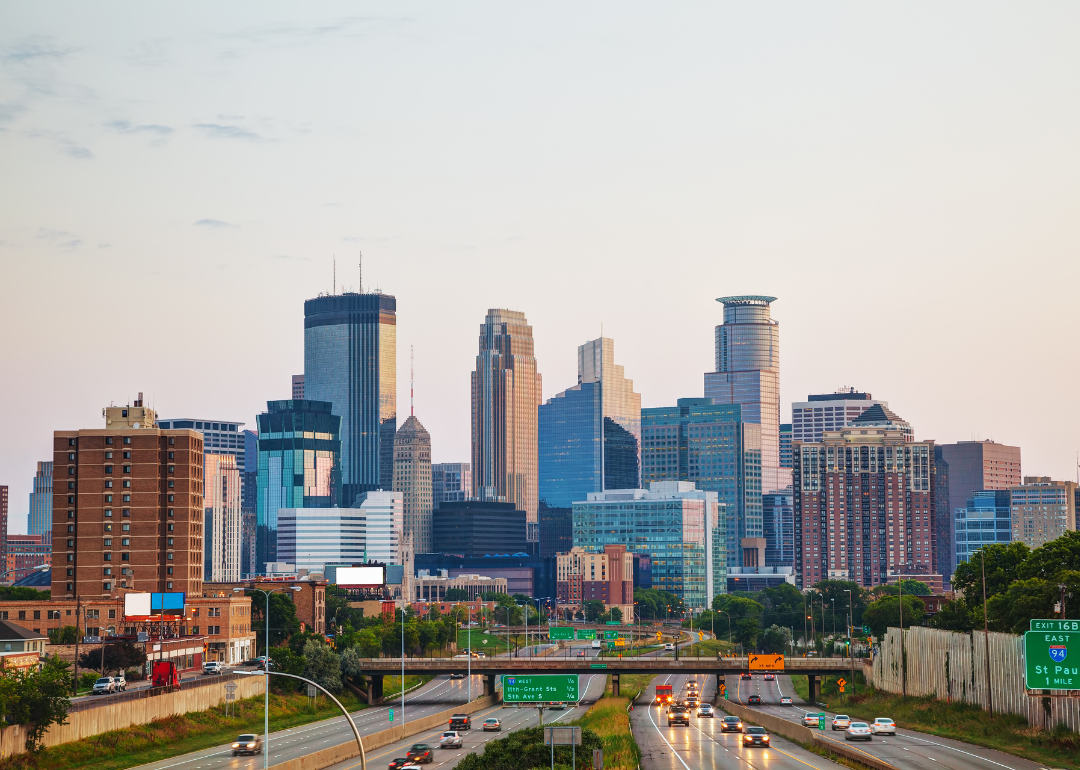 A highway with the Minneapolis skyline in the background.