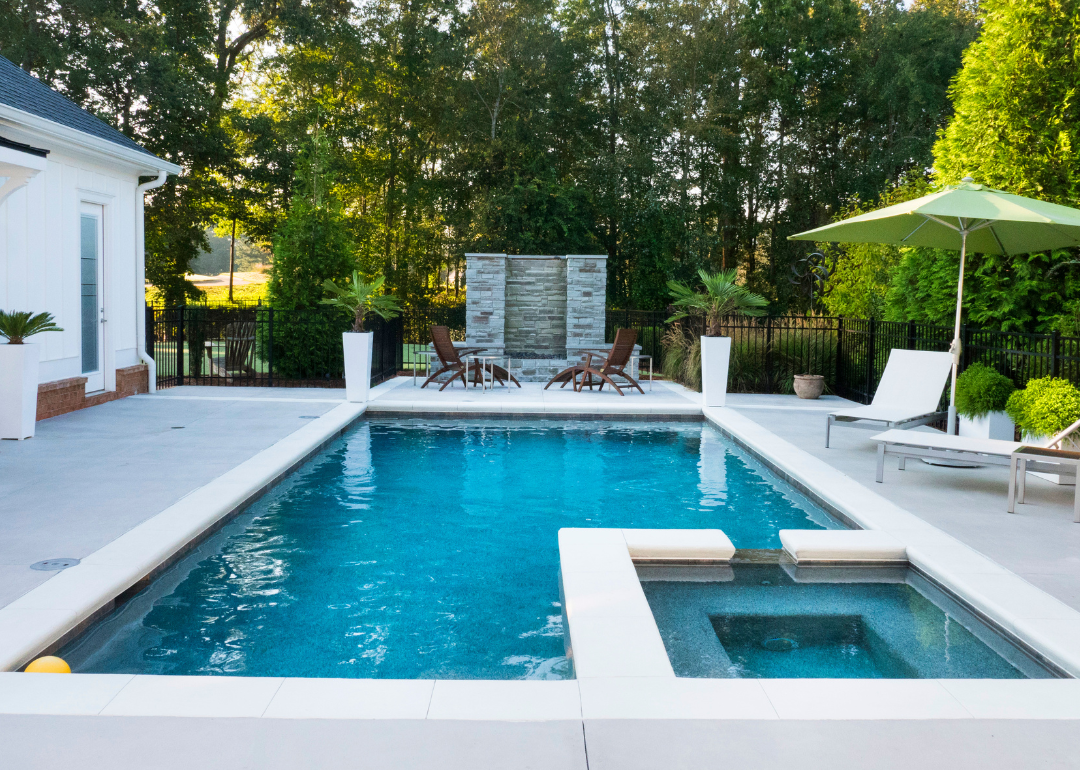 A home swimming pool and hot tub.