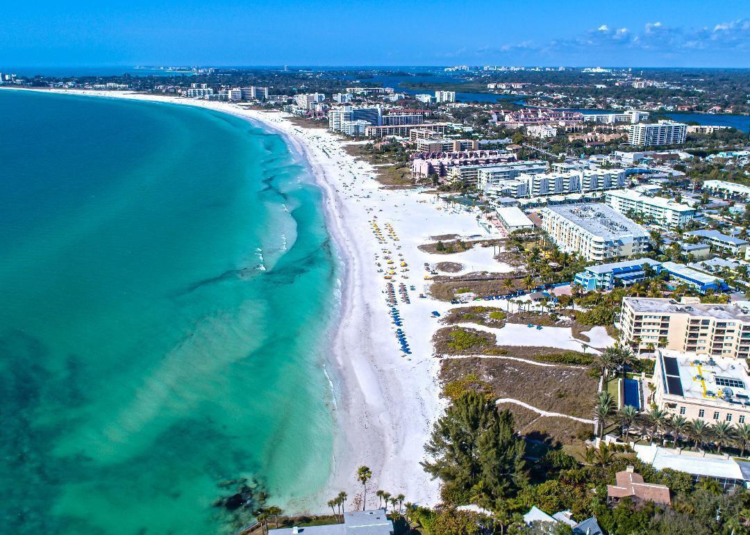 Aerial view of Siesta Key with white sandy beaches and buildings.