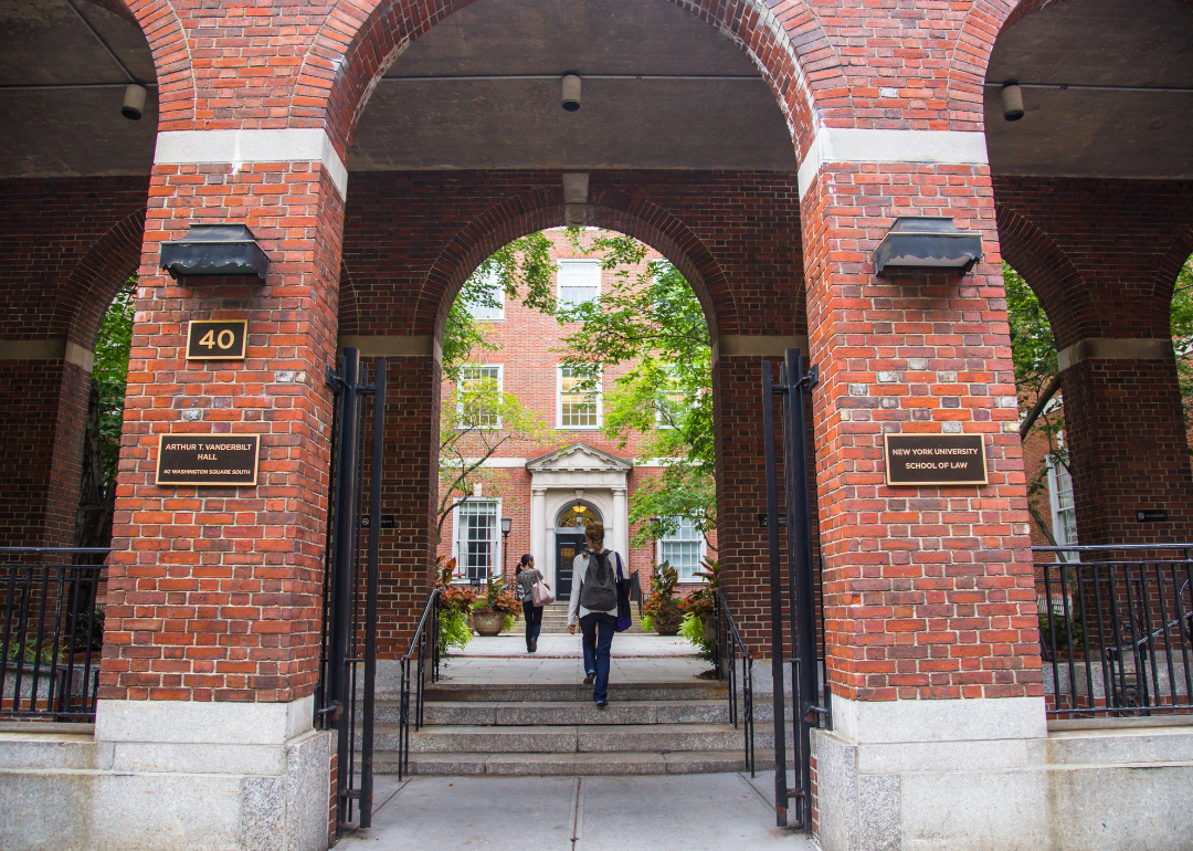 Students walk through gate at NYU School of Law.