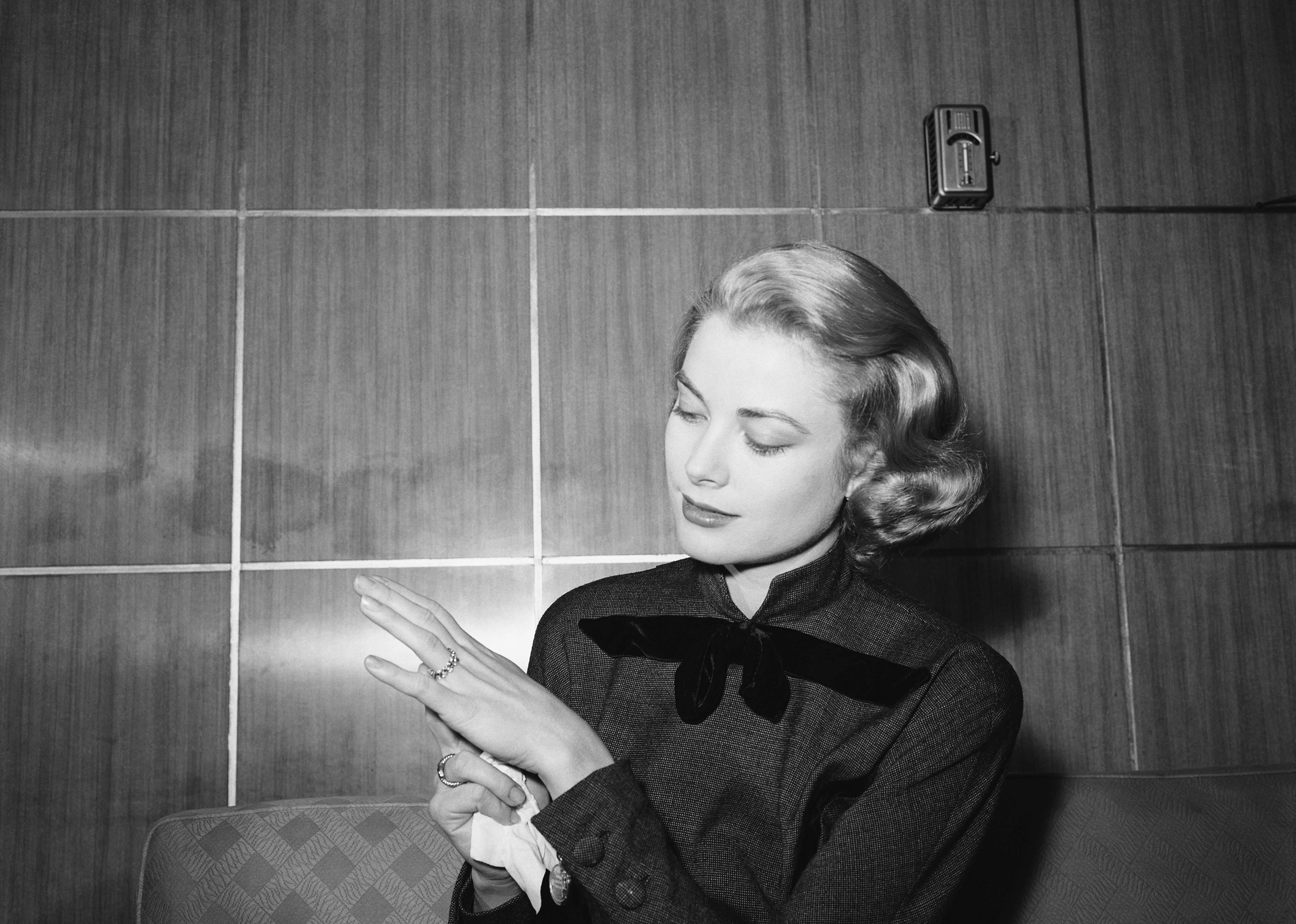 Grace Kelly strikes a pose to show off her engagement ring.