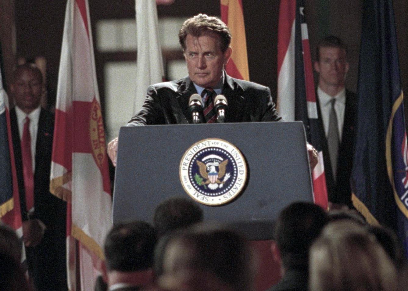 Martin Sheen in front of the presidential podium.