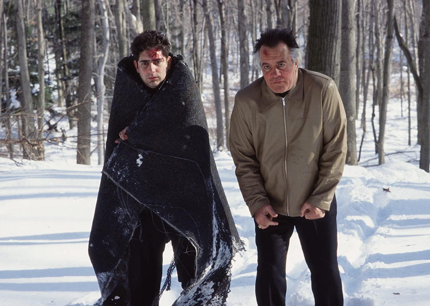 Michael Imperioli and Tony Sirico walking in the snow with injuries.