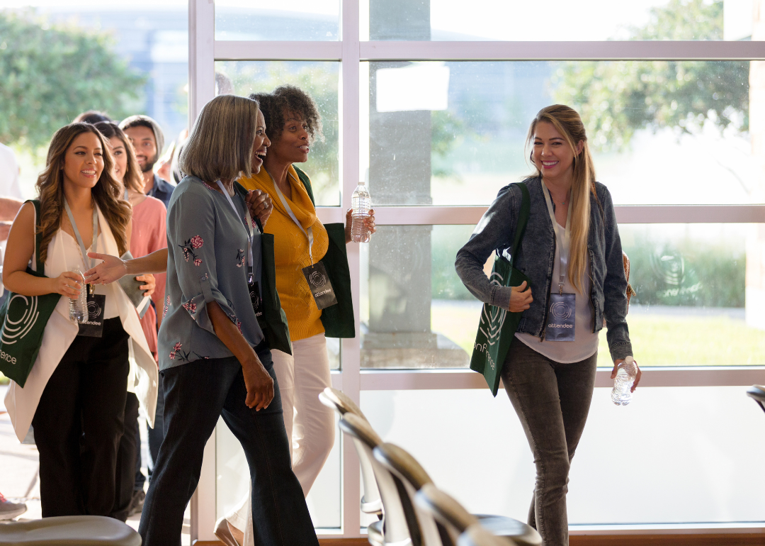 A group of people enter an event venue.