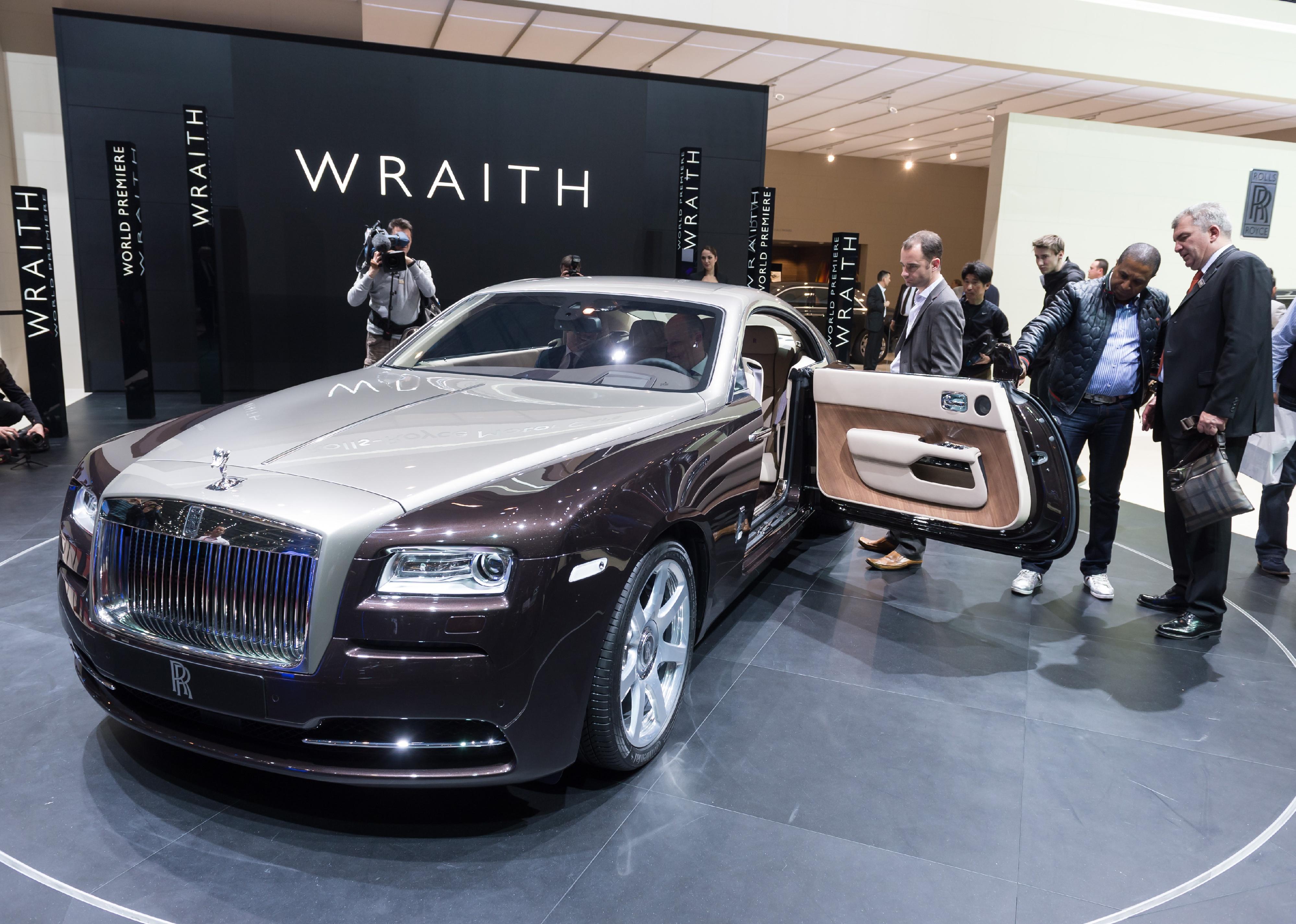 A Rolls Royce Wraith on a showroom floor.