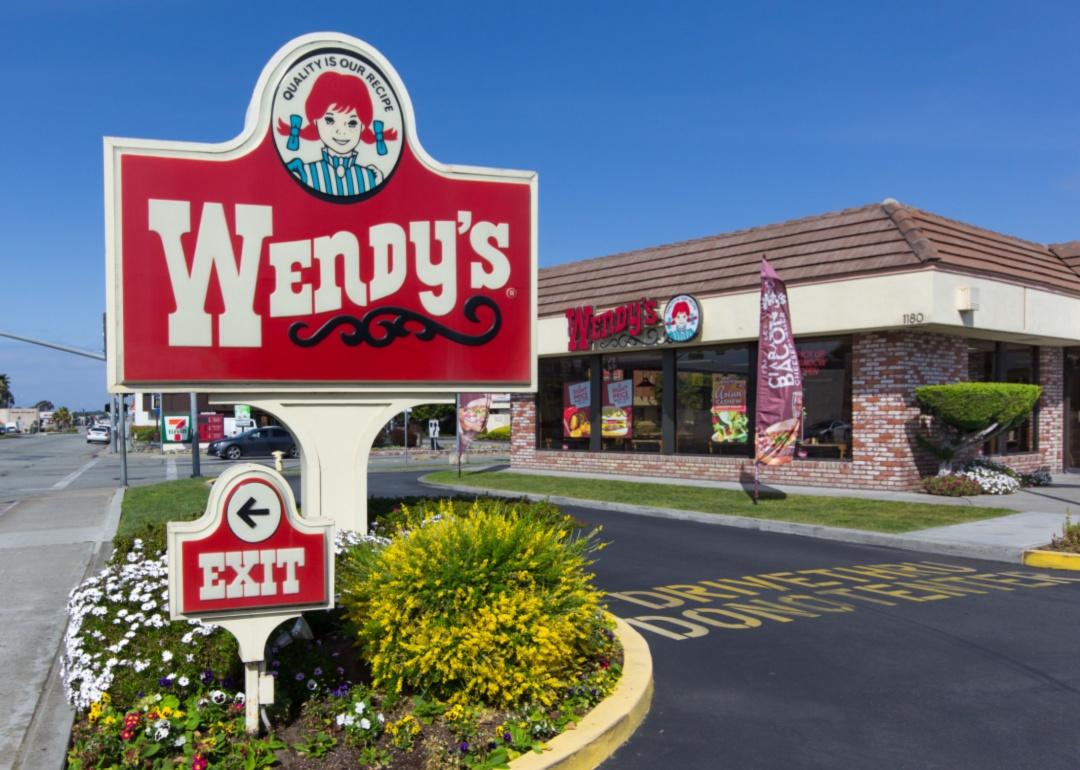 The exterior red sign of a Wendy's restaurant.