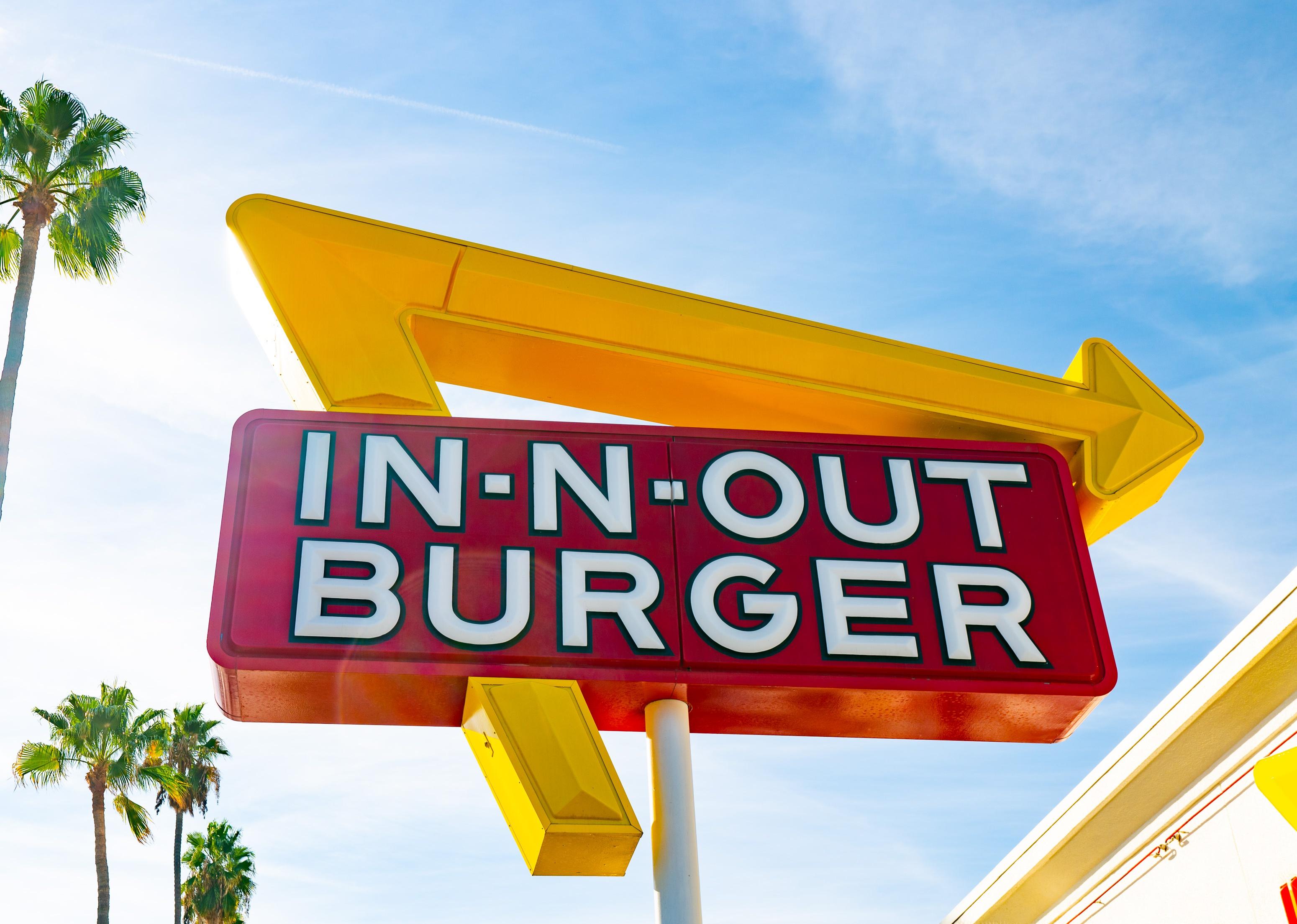 A giant red and yellow In-N-Out Burger sign.