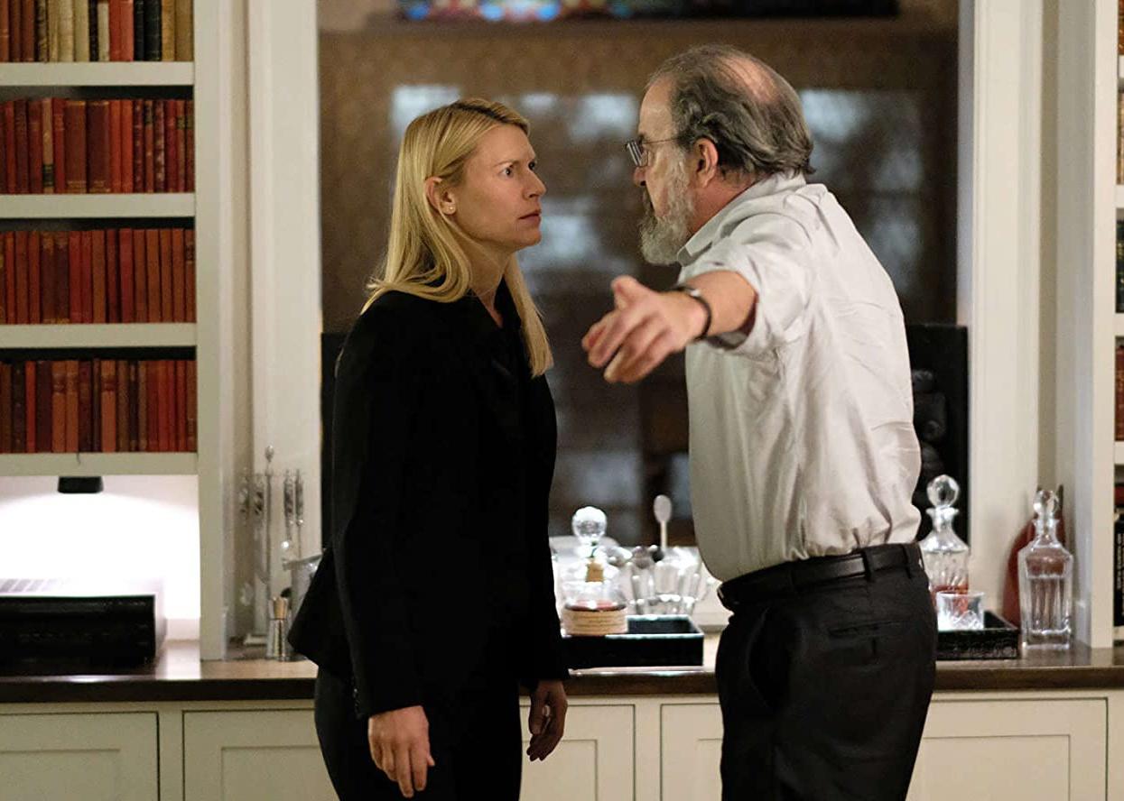 Claire Danes having a very serious conversation with a man.