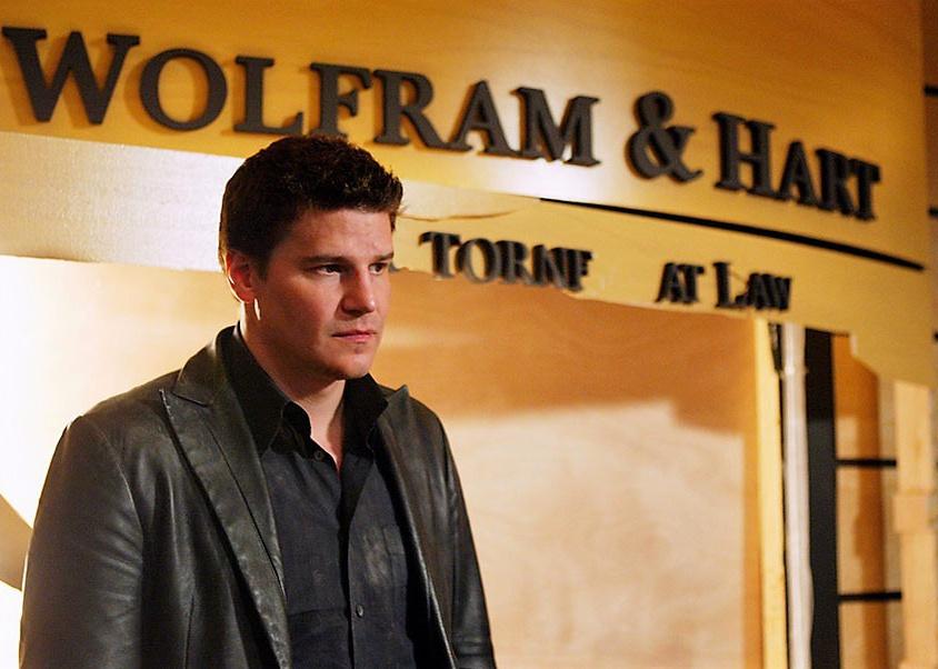 David Boreanaz in front of a law office sign.