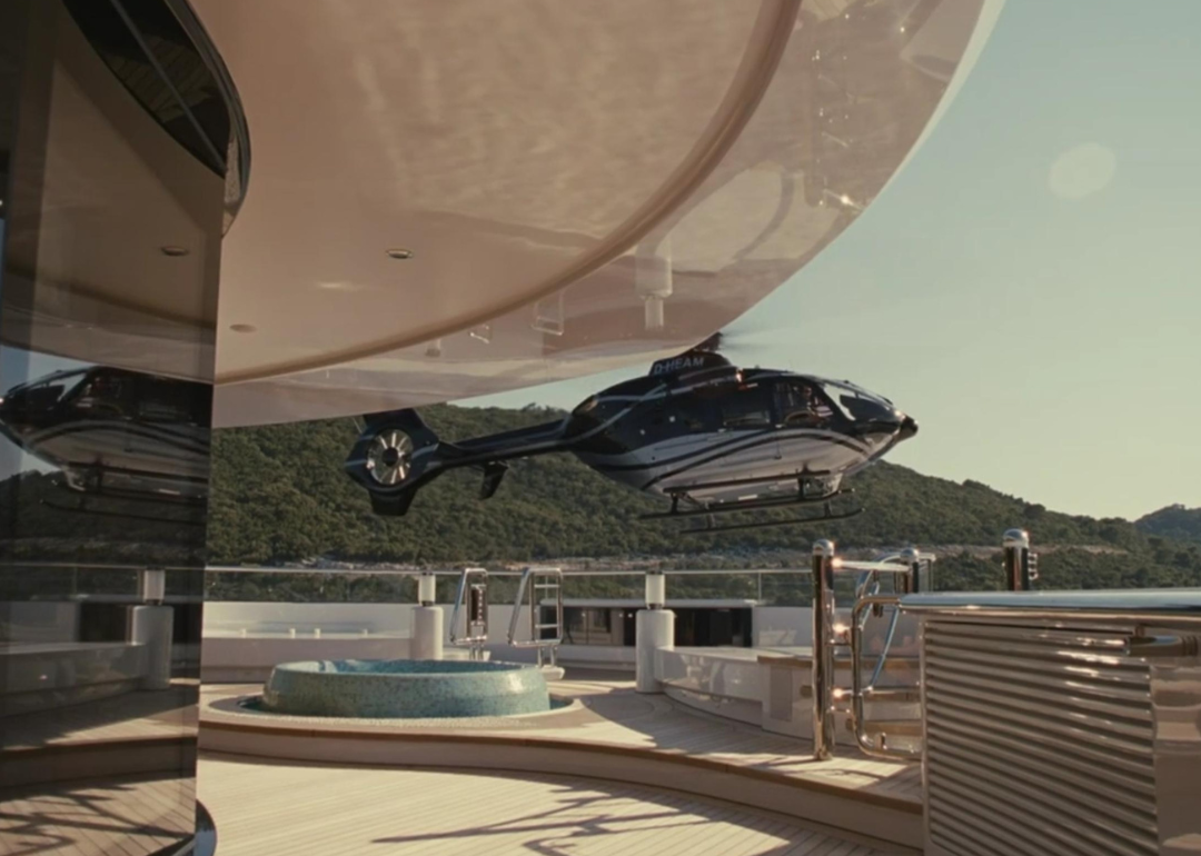 A helicopter landing on a yacht.