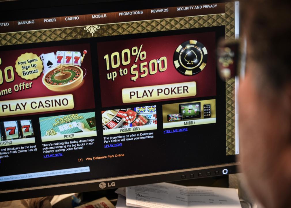 A person looking at a gambling website on a desktop computer.