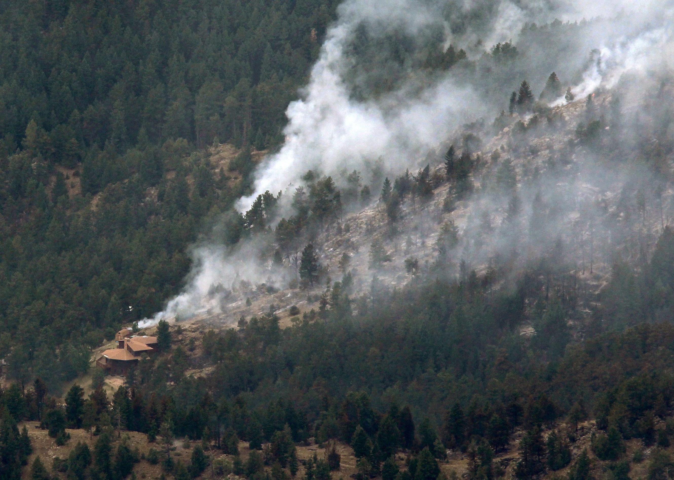  A wildfire burns through the foothills of the Rocky Mountains.