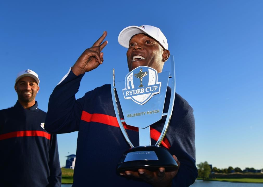 Samuel L Jackson celebrates with the trophy ahead of the 2018 Ryder Cup.