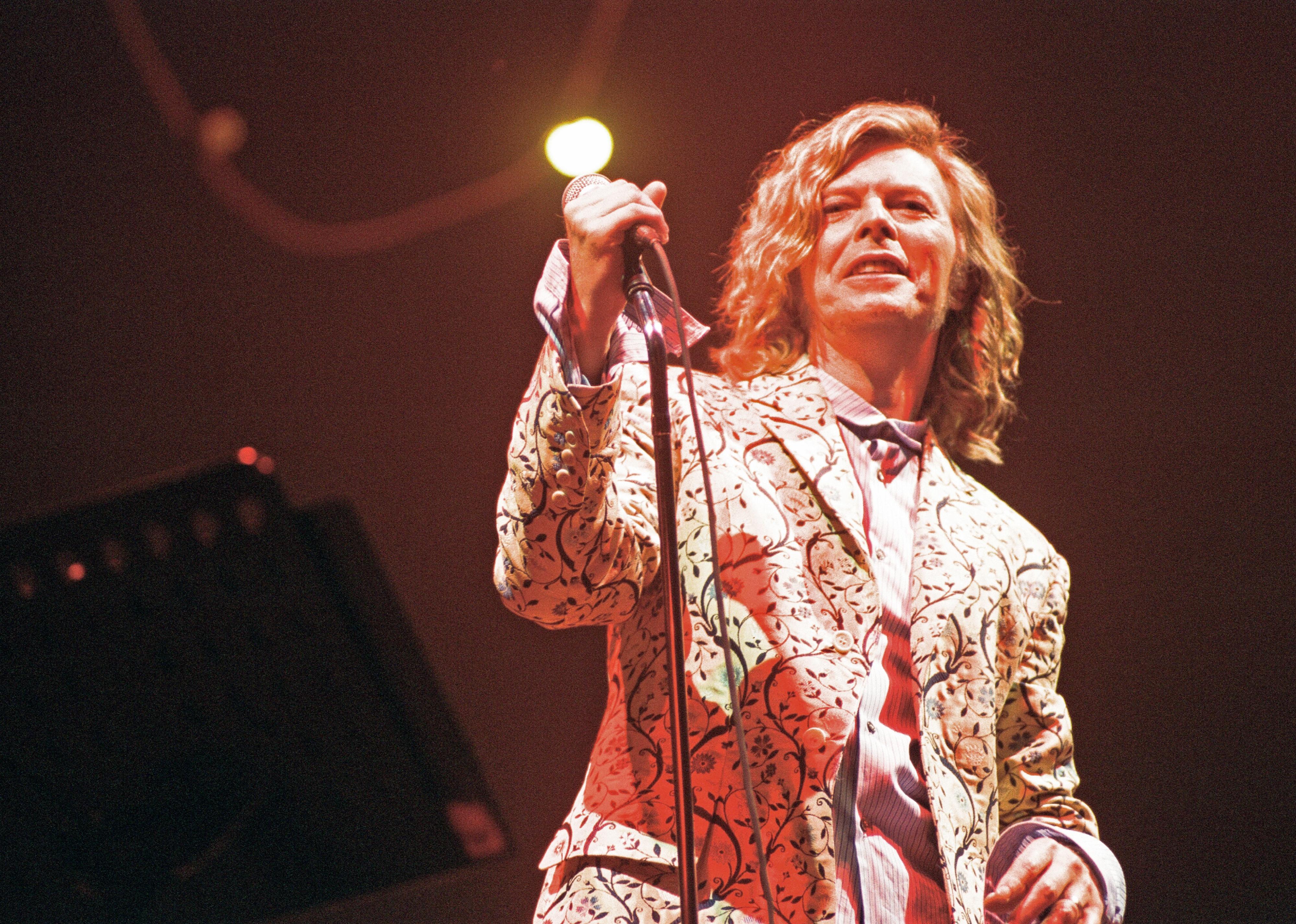 David Bowie performing on the pyramid stage at Glastonbury. 