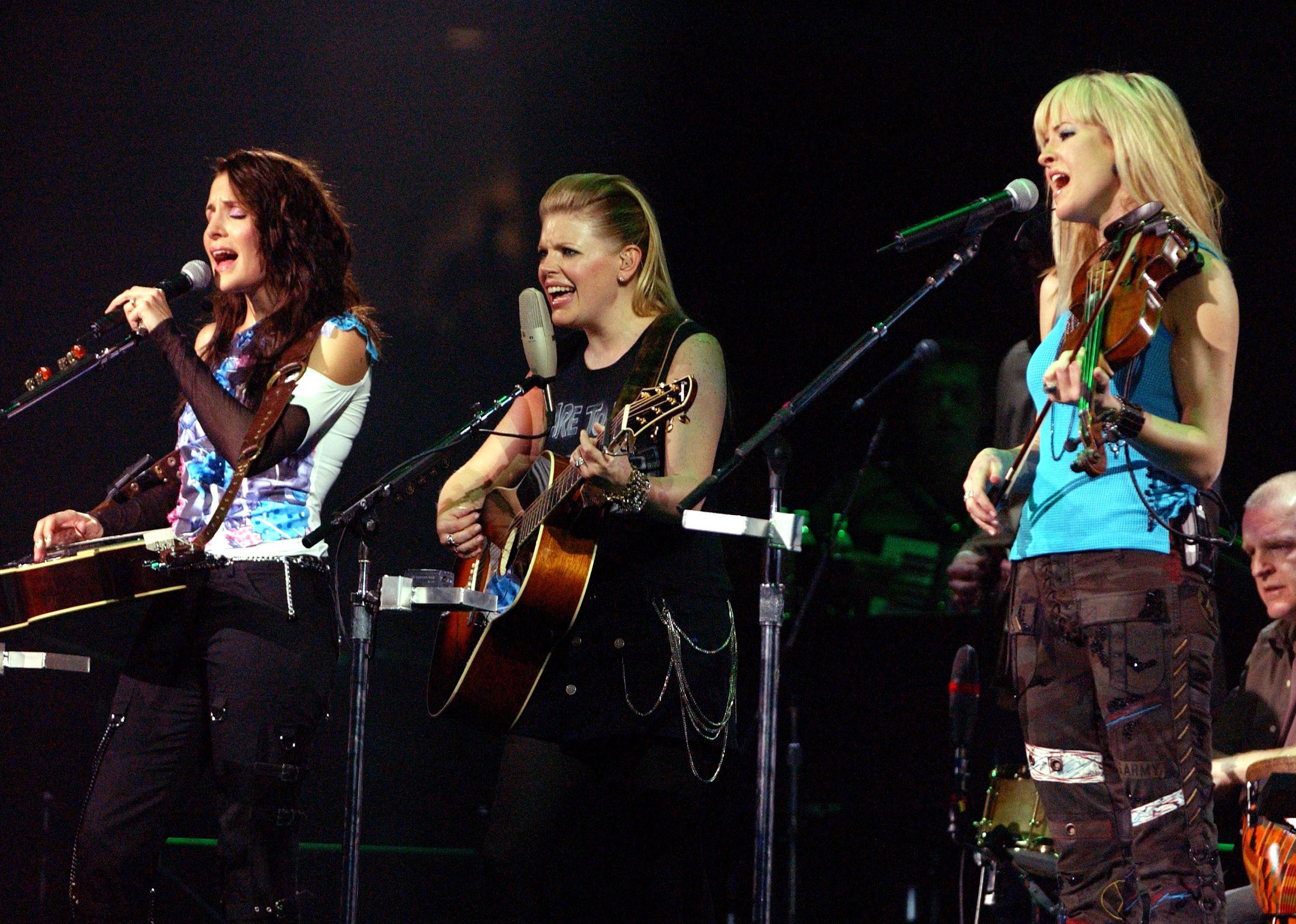 Emily Robison, Natalie Maines and Martie Seidel of Dixie Chicks performing at the 2003 U.S. Tour opening show.