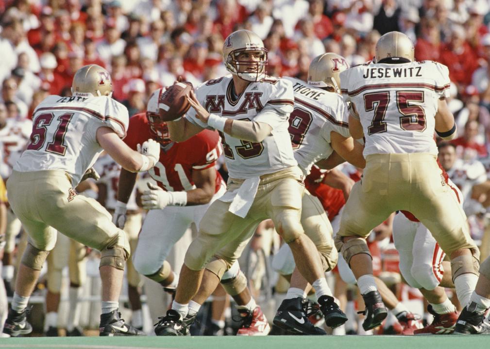 Quarterback for the University of Minnesota Golden Gophers prepares to throw the ball 