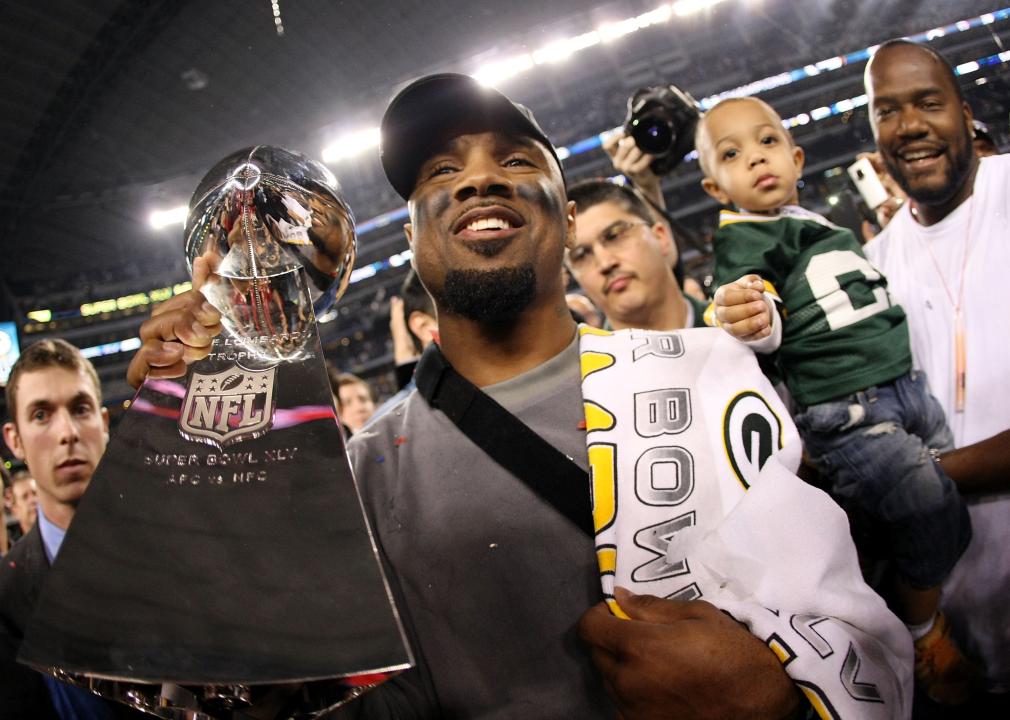 Charles Woodson celebrates with the Vince Lombardi Trophy after the Super Bowl XLV.
