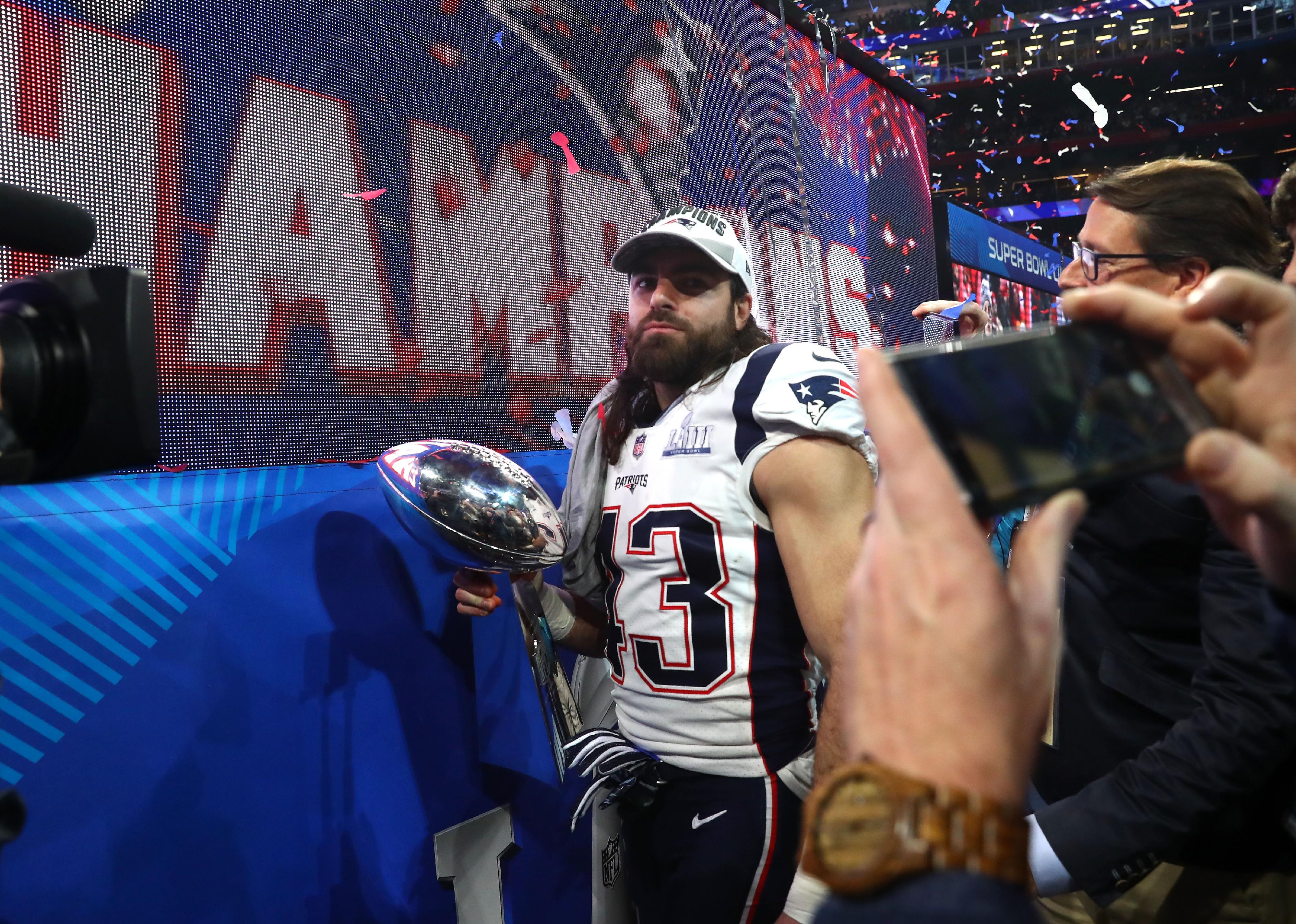 Nate Ebner of the New England Patriots celebrates with the Vince Lombardi Trophy.