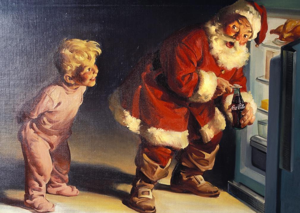 Illustration depicting boy surprising Santa Claus taking a Coca Cola out of the refrigerator.