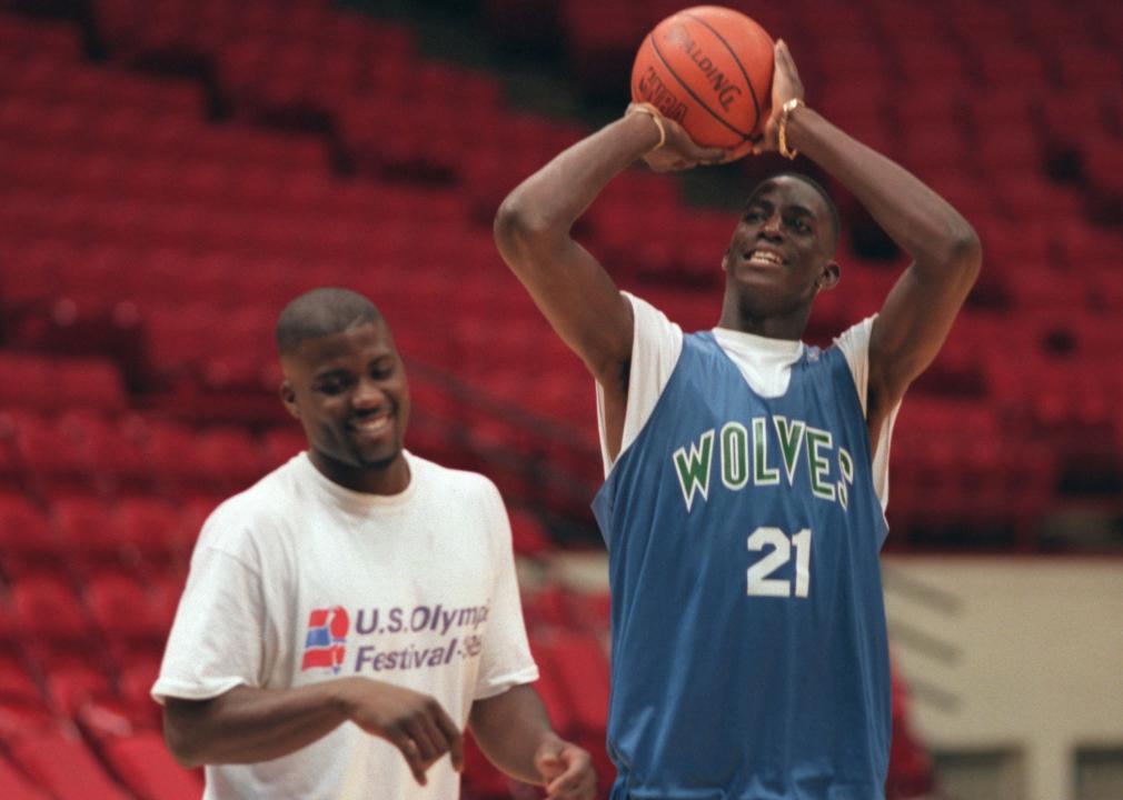 Wolves rookie draft player Kevin Garnett shoots after practice with JR Rider.