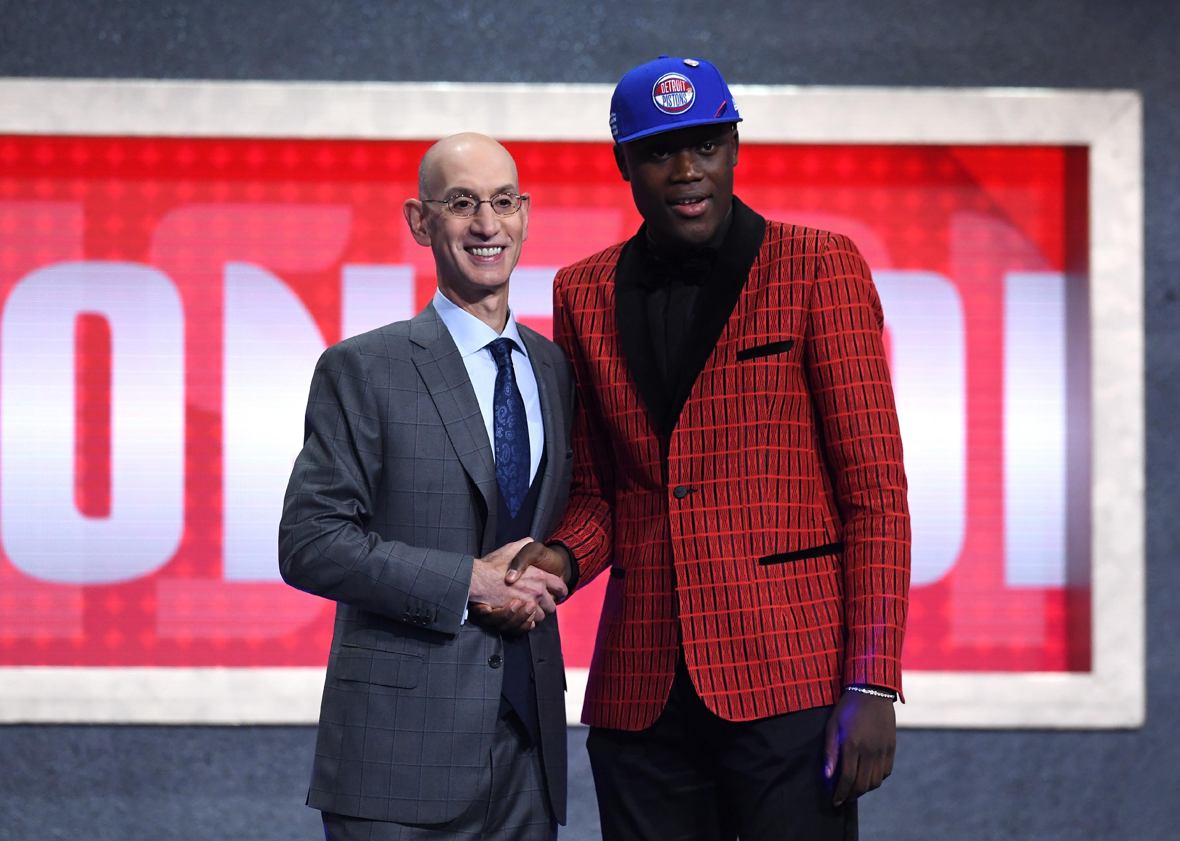 Sekou Doumbouya with NBA Commissioner Adam Silver after being drafted.