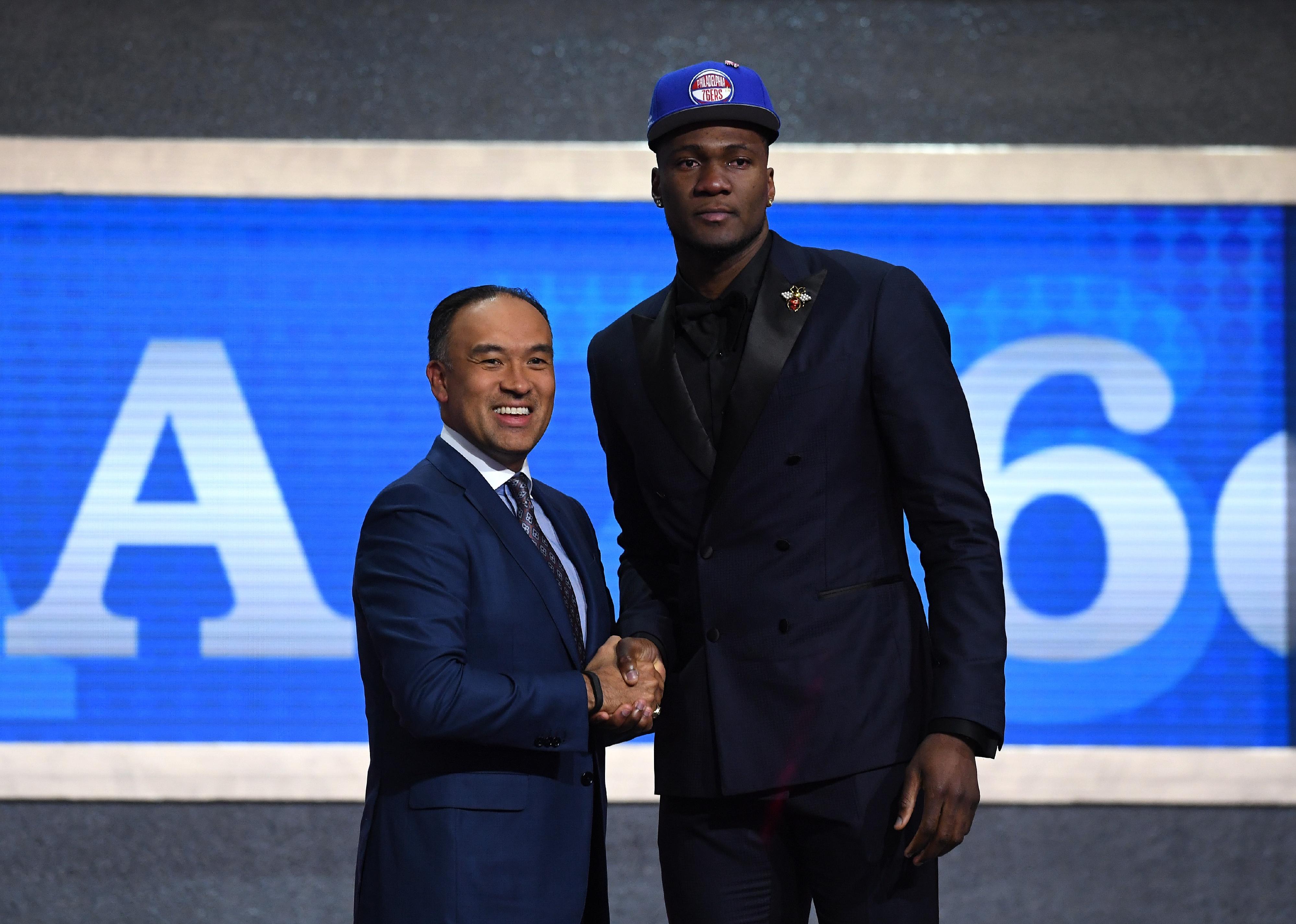 Bruno Fernando with NBA Deputy Commissioner Mark Tatu.
