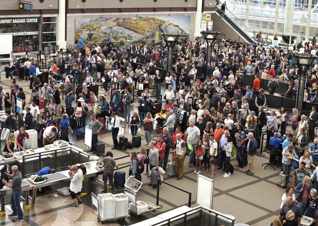 Passengers line up for TSA security screenings at Denver International Airport