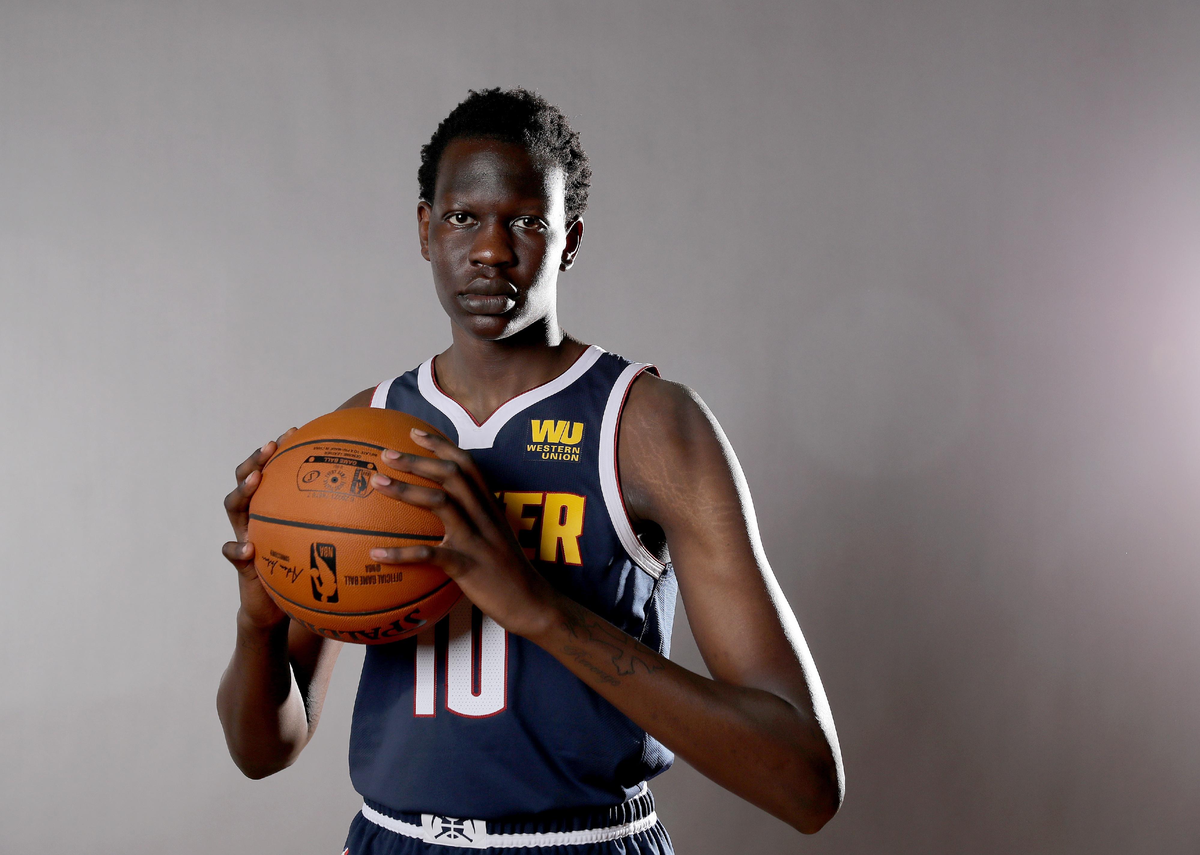 Bol Bol poses for a photo with the ball during the 2019 NBA Rookie Photo Shoot.